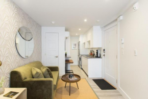 Serene and Styled Little Italy Studio full bath by Den Stays